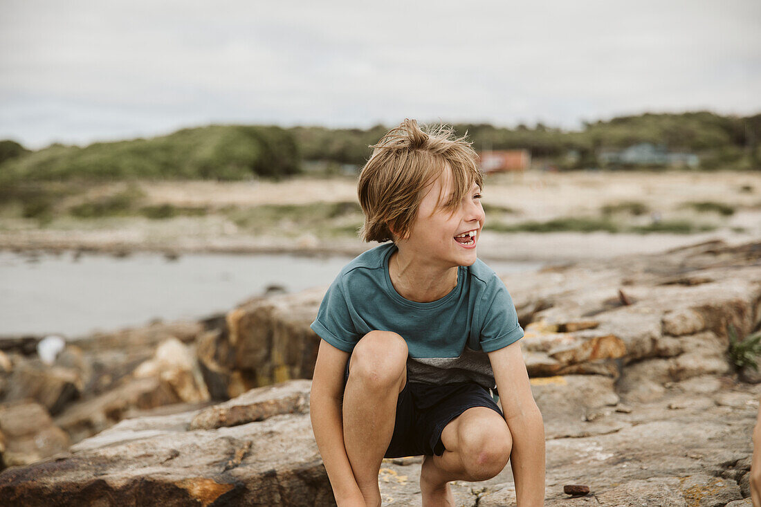 Cheerful boy at seaside