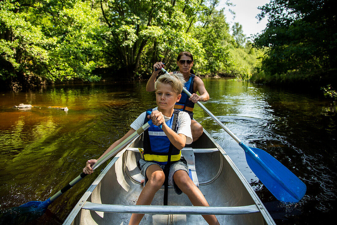 Mother with son kayaking