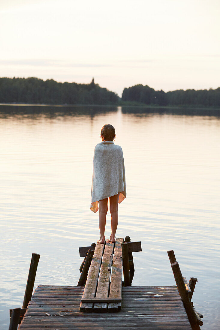 Girl standing on jetty