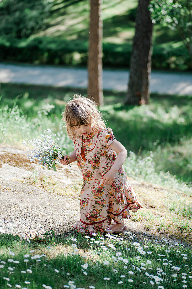 Girl picking flowers