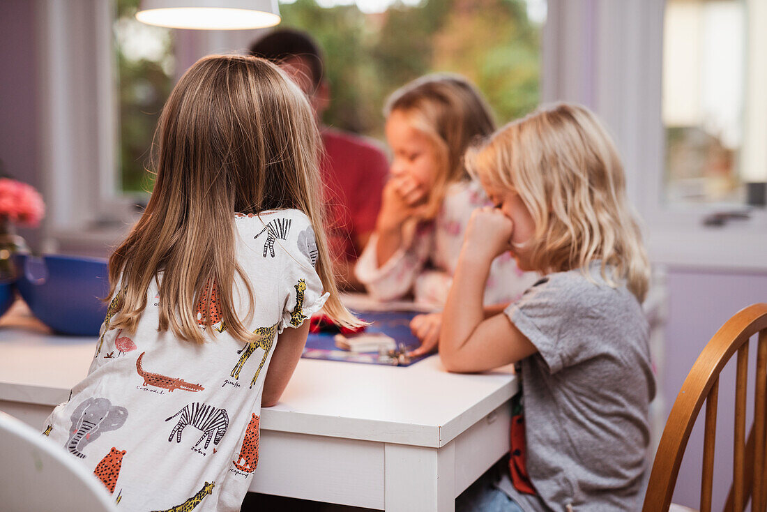 Girls playing board game