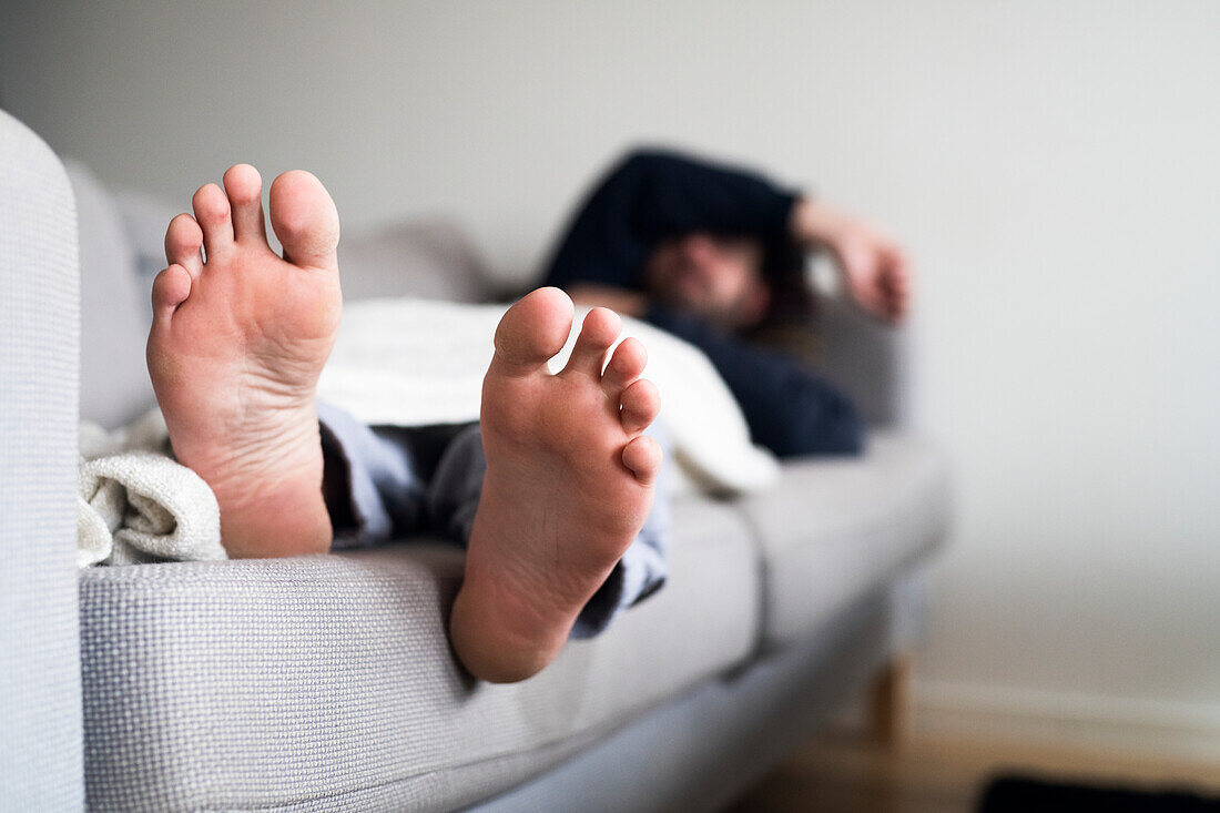 Man sleeping on sofa