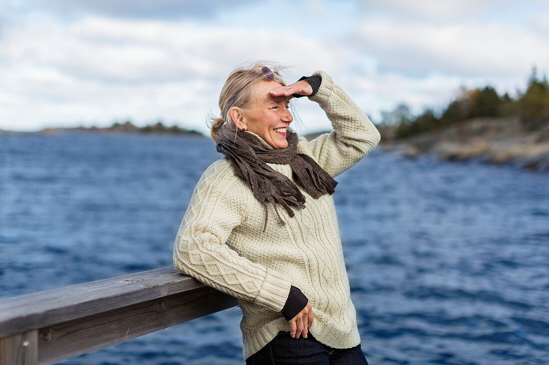 Smiling woman at lake