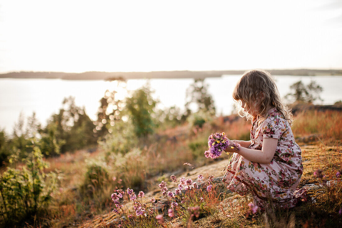 Girl picking flowers