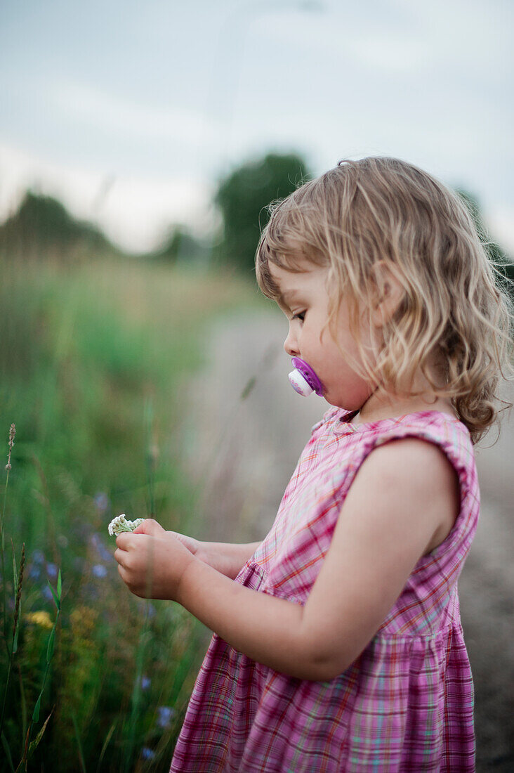 Girl picking flowers