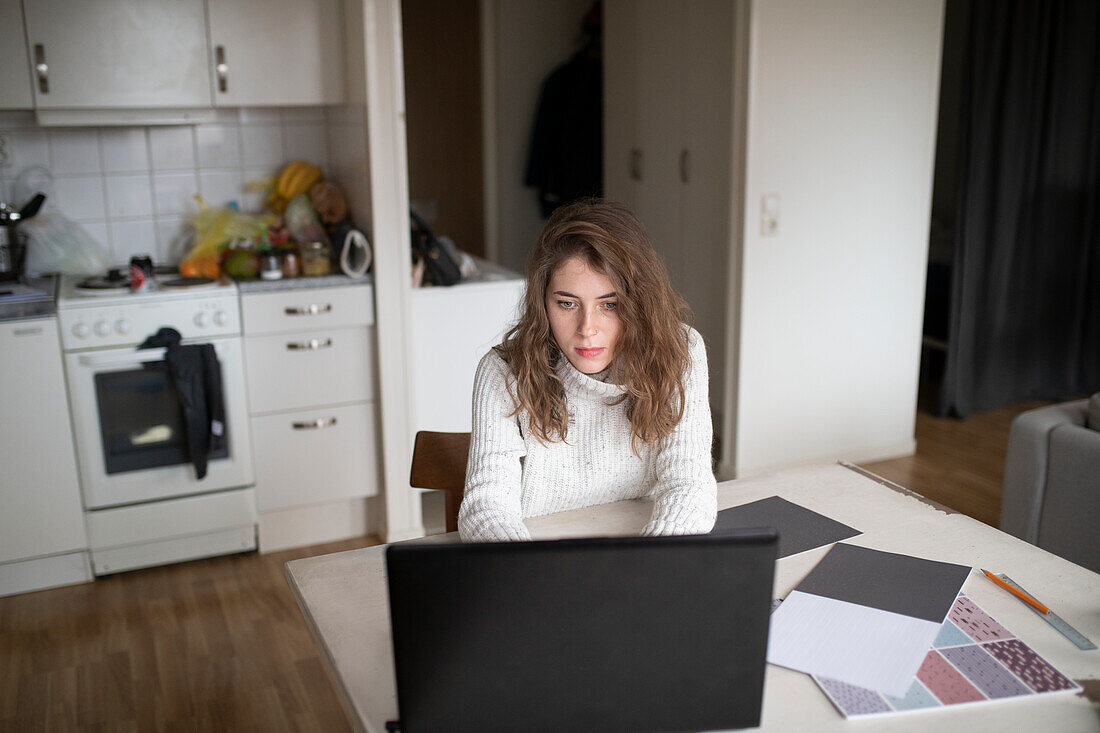 Young woman using laptop