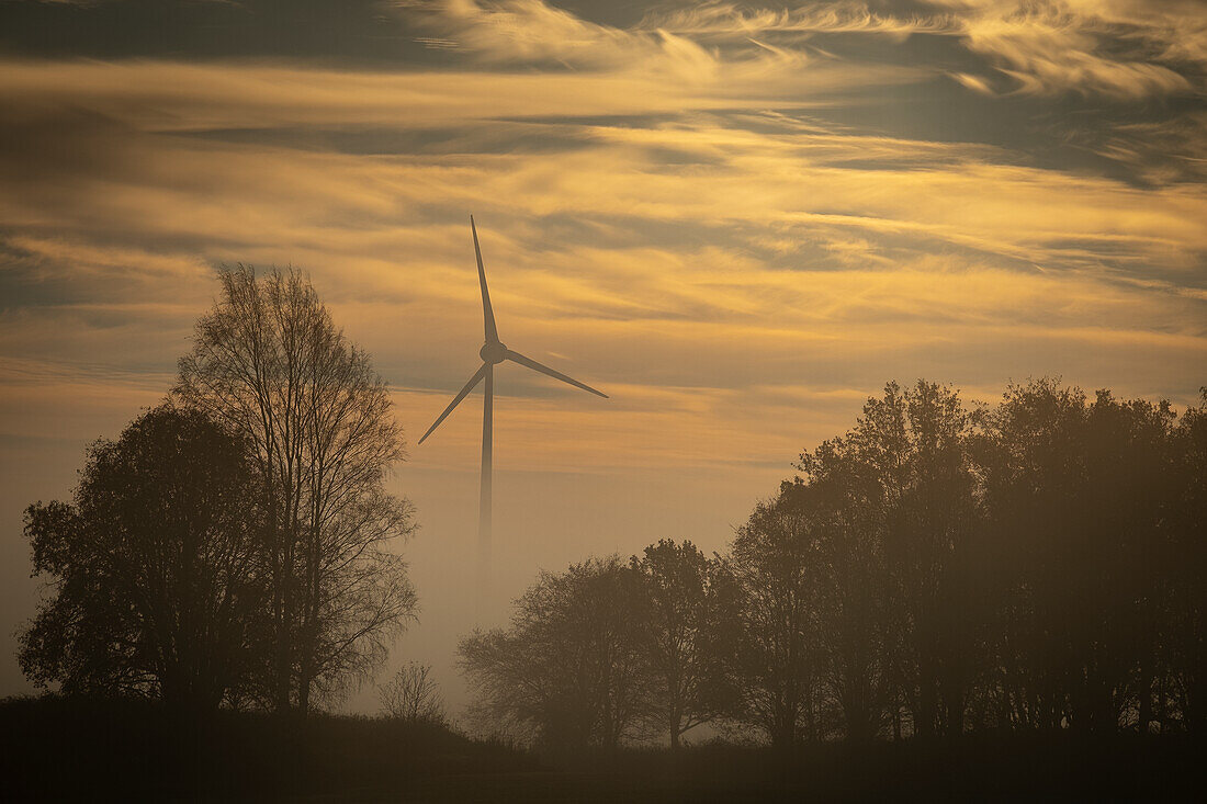 Wind turbine at sunset