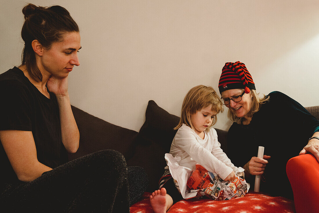 Girl opening Christmas present