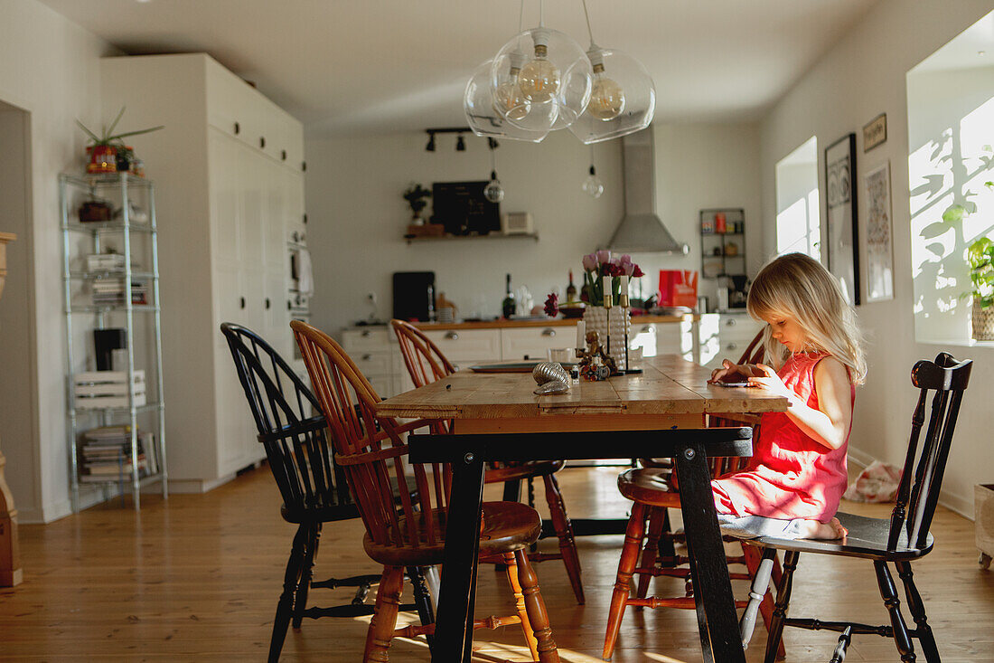 Girl sitting at table