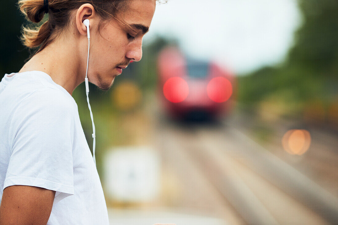 Man on train station platform