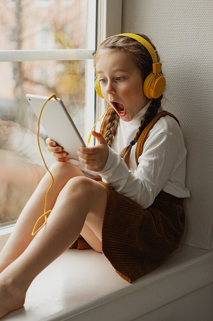 Girl using digital tablet