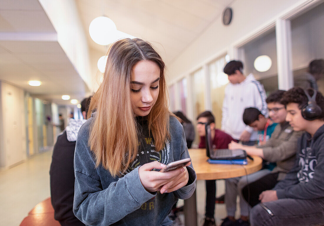 Teenage girl using phone