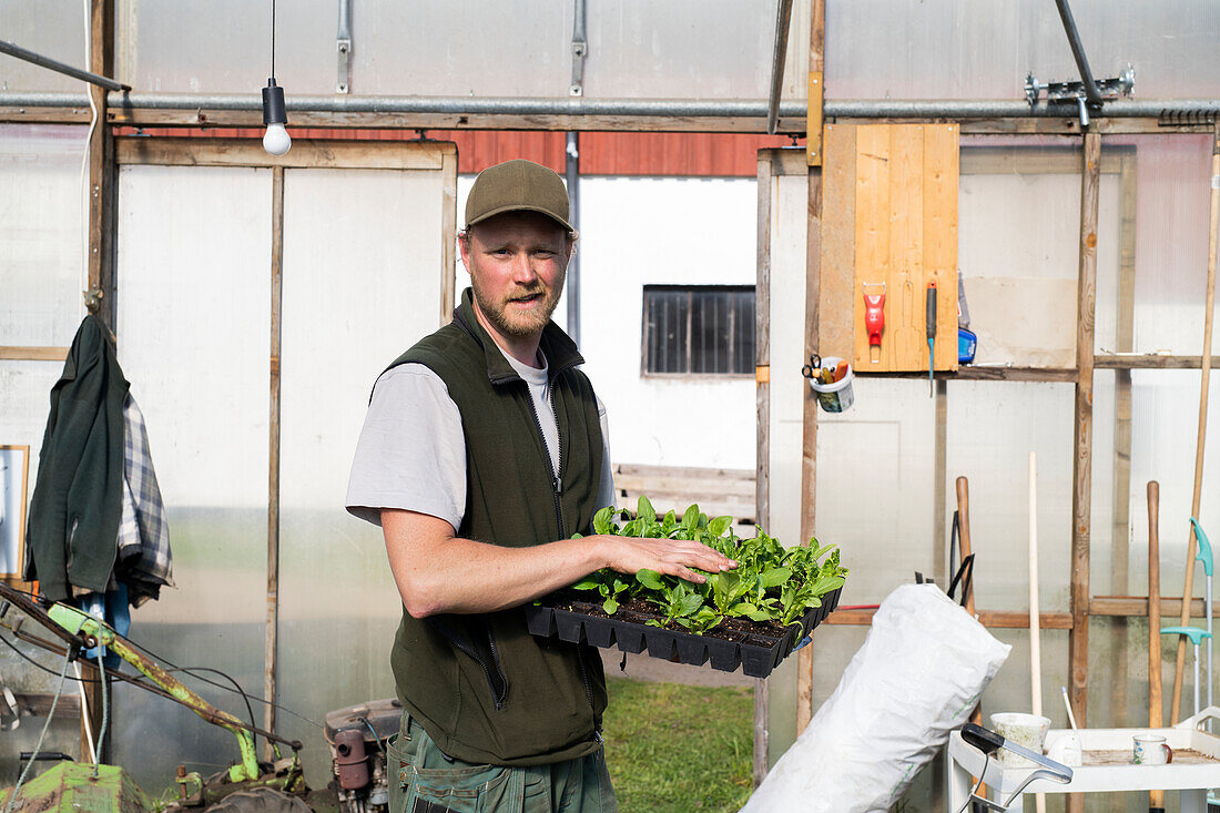 Man in greenhouse