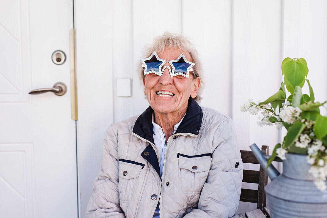 Woman wearing star-shaped sunglasses