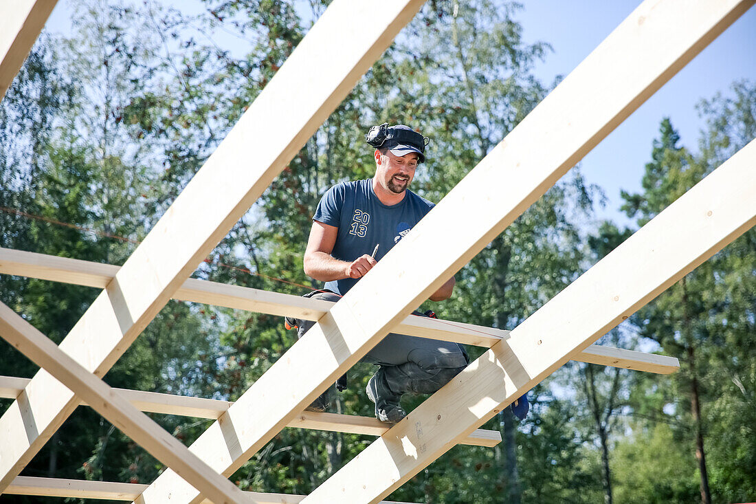 Carpenter working on roof