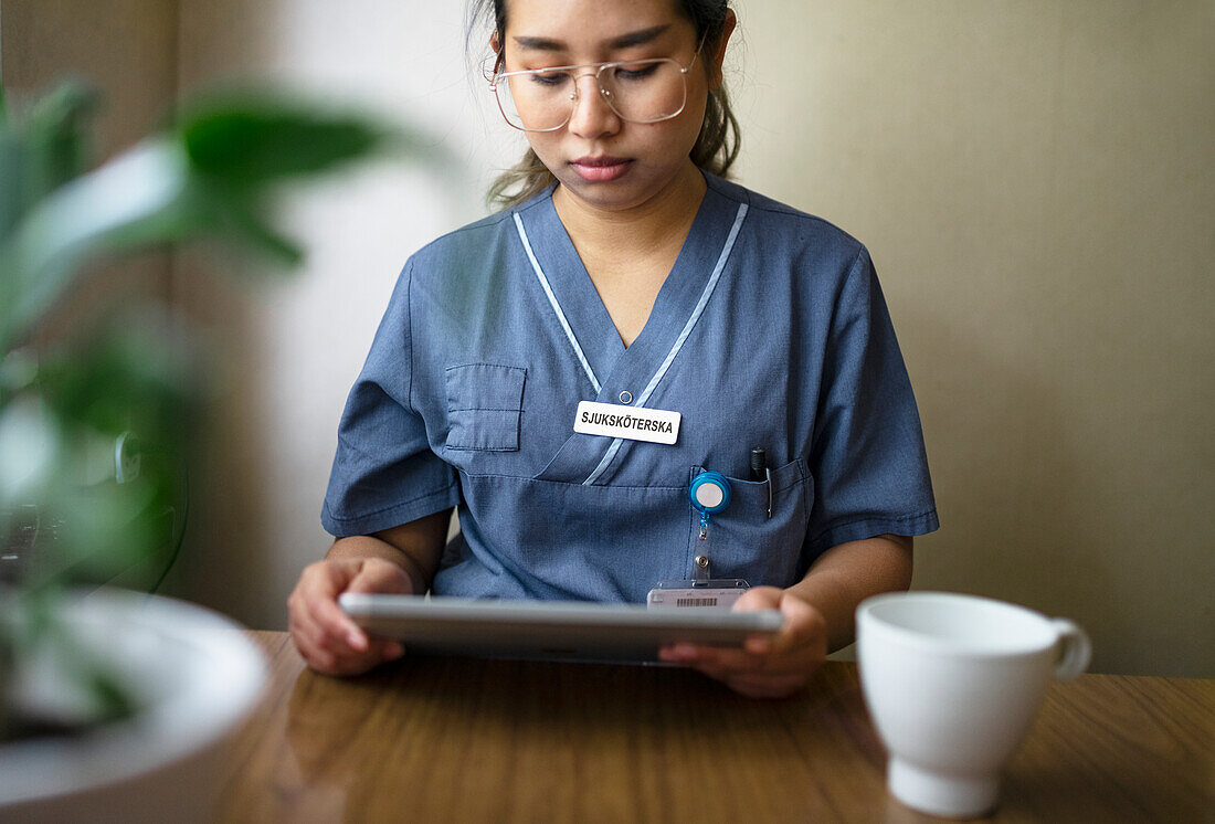 Nurse using digital tablet