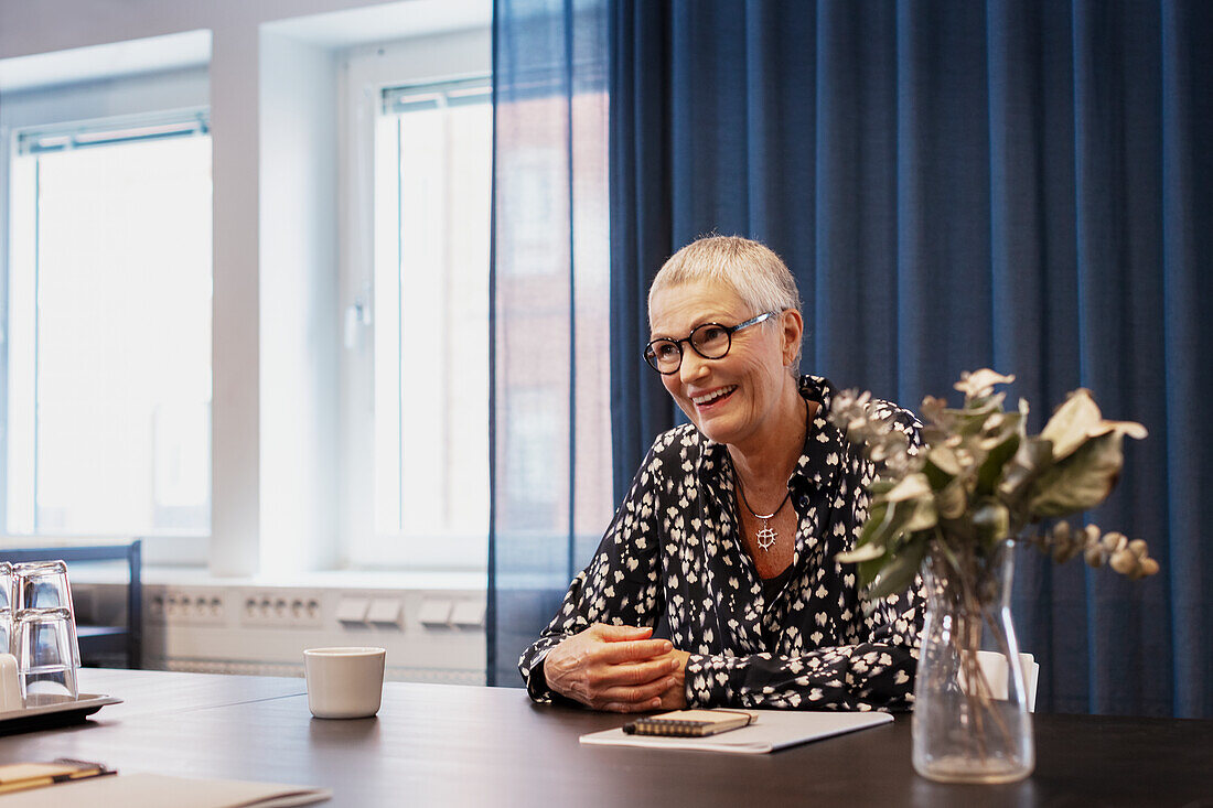 Woman at meeting table