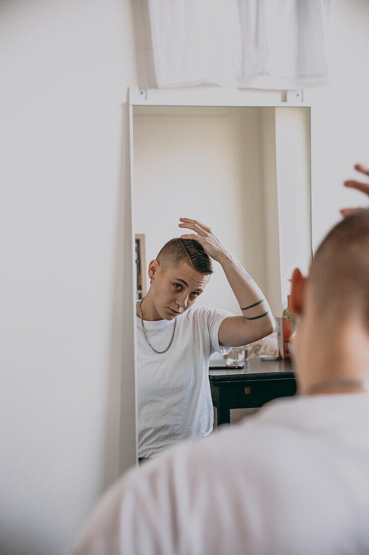 Woman looking at reflection in mirror