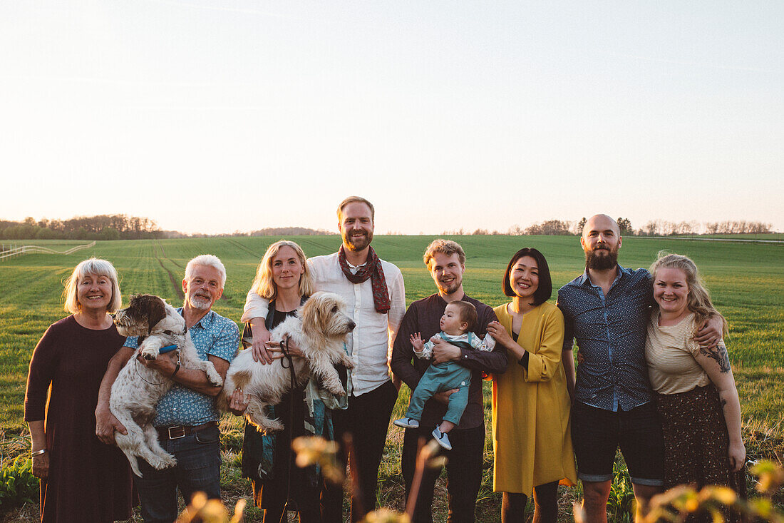 Smiling family looking at camera