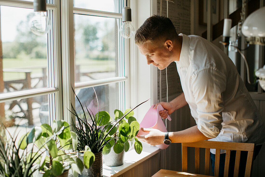 Man watering flowers