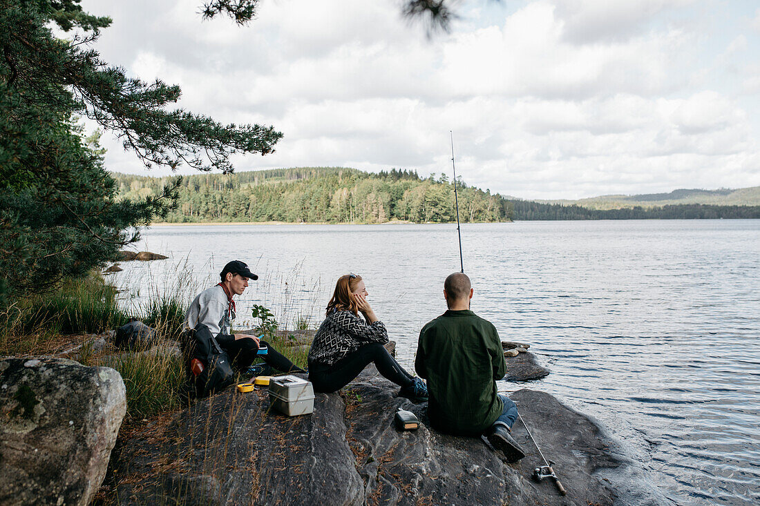 Friends fishing at lake