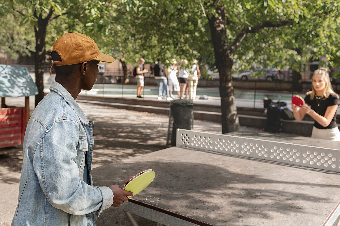 People playing table tennis