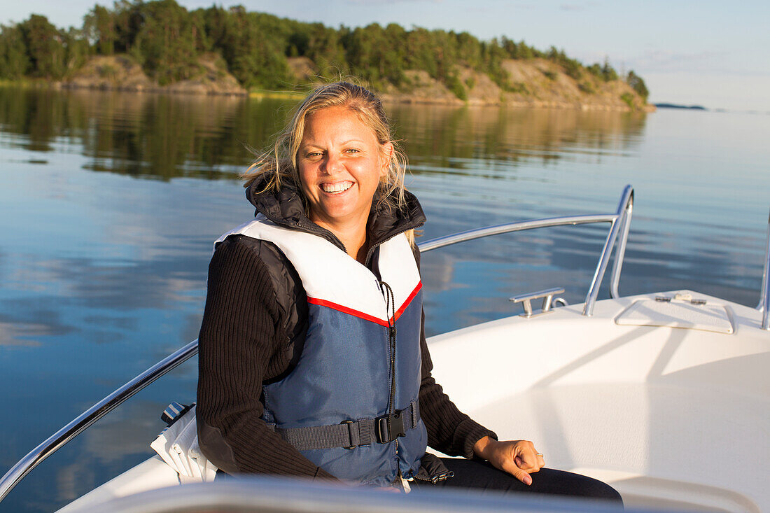 Smiling woman on boat