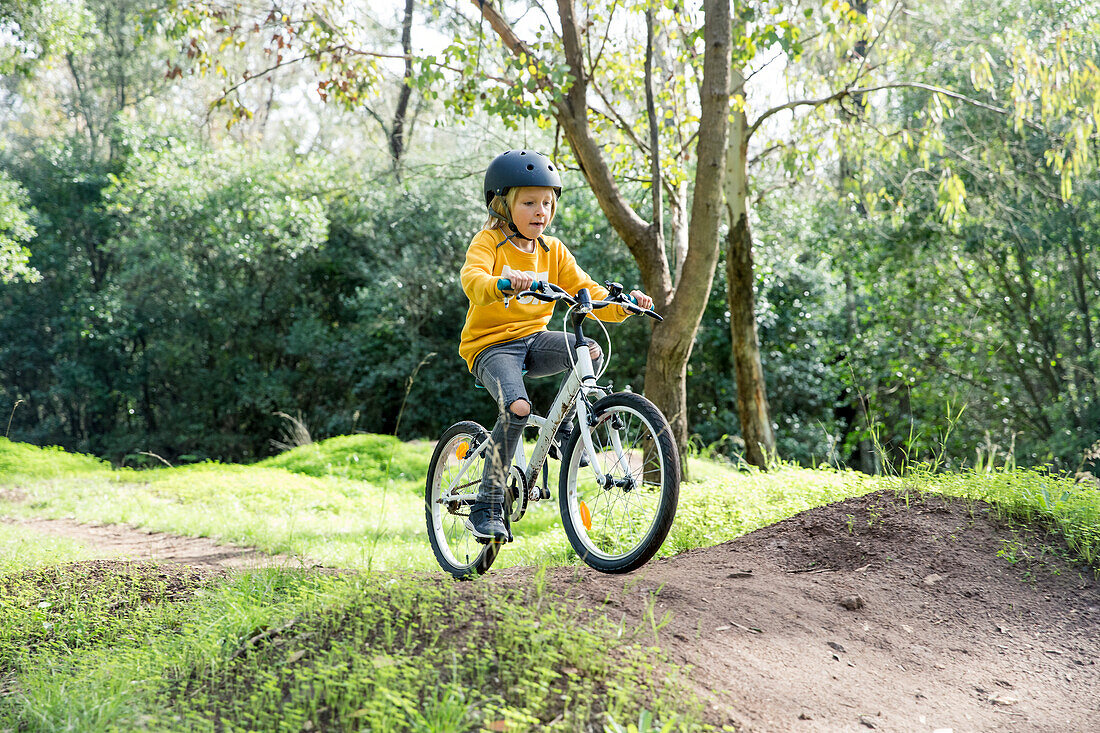 Girl cycling at summer