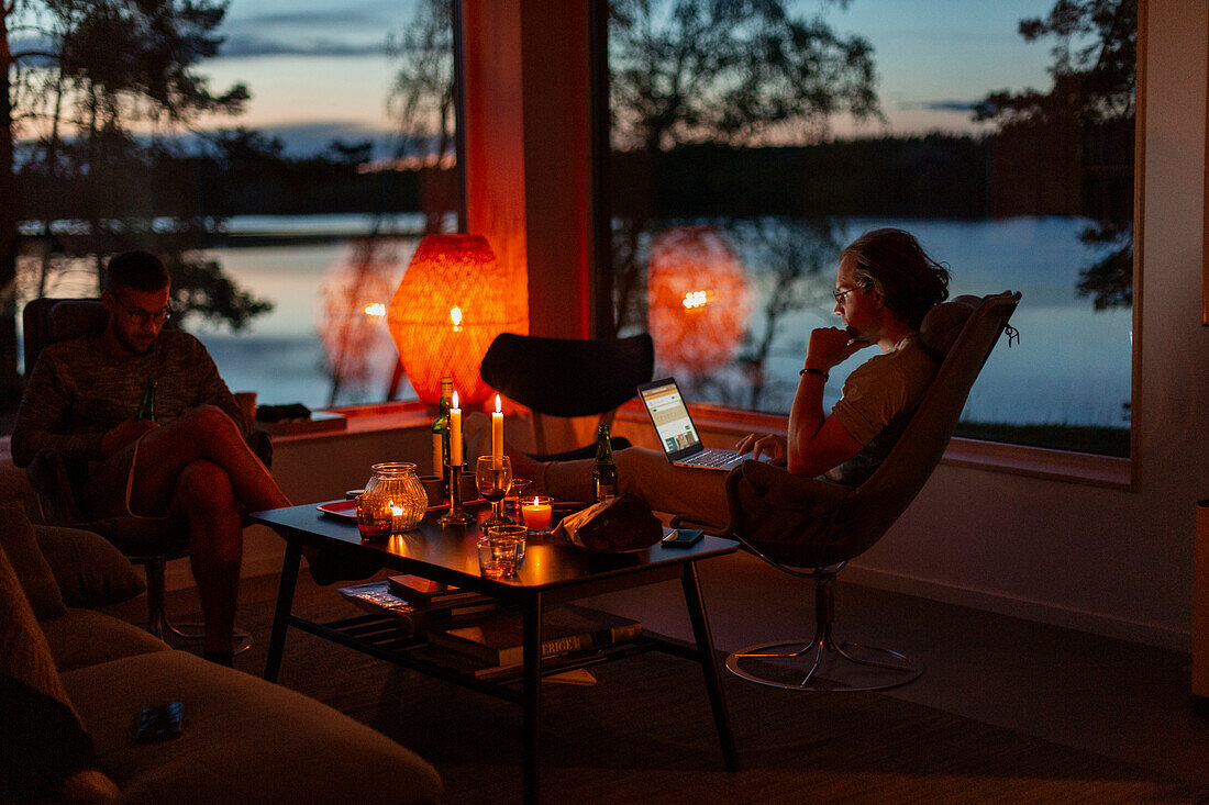 Men relaxing at home in evening