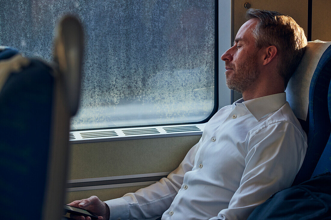 Man sleeping in train