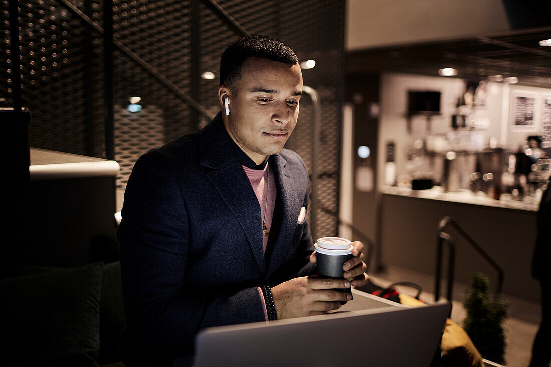 Young businessman working late