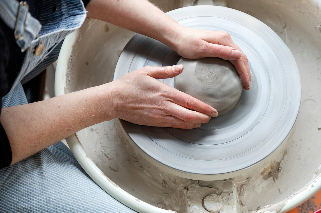 Womans hands modeling clay