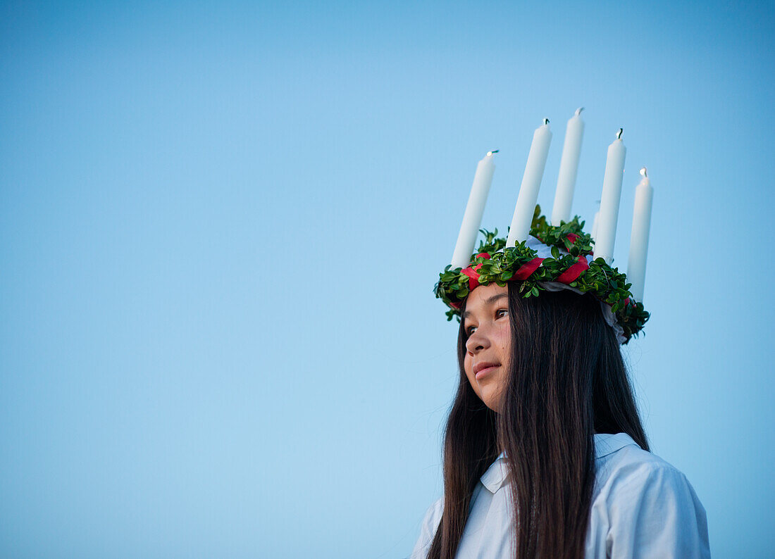 Girl at St Lucias Day wearing traditional clothing