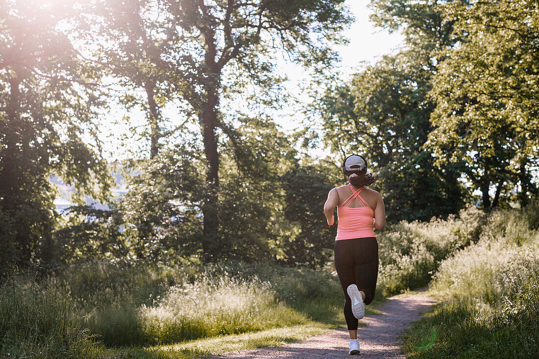 Rear view of woman jogging