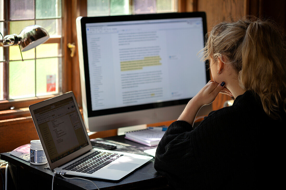 Woman using computer at home