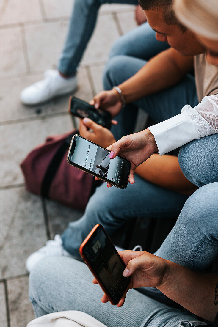 Peoples hands holding cell phones