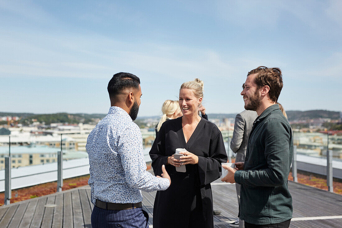 Coworkers talking during coffee break