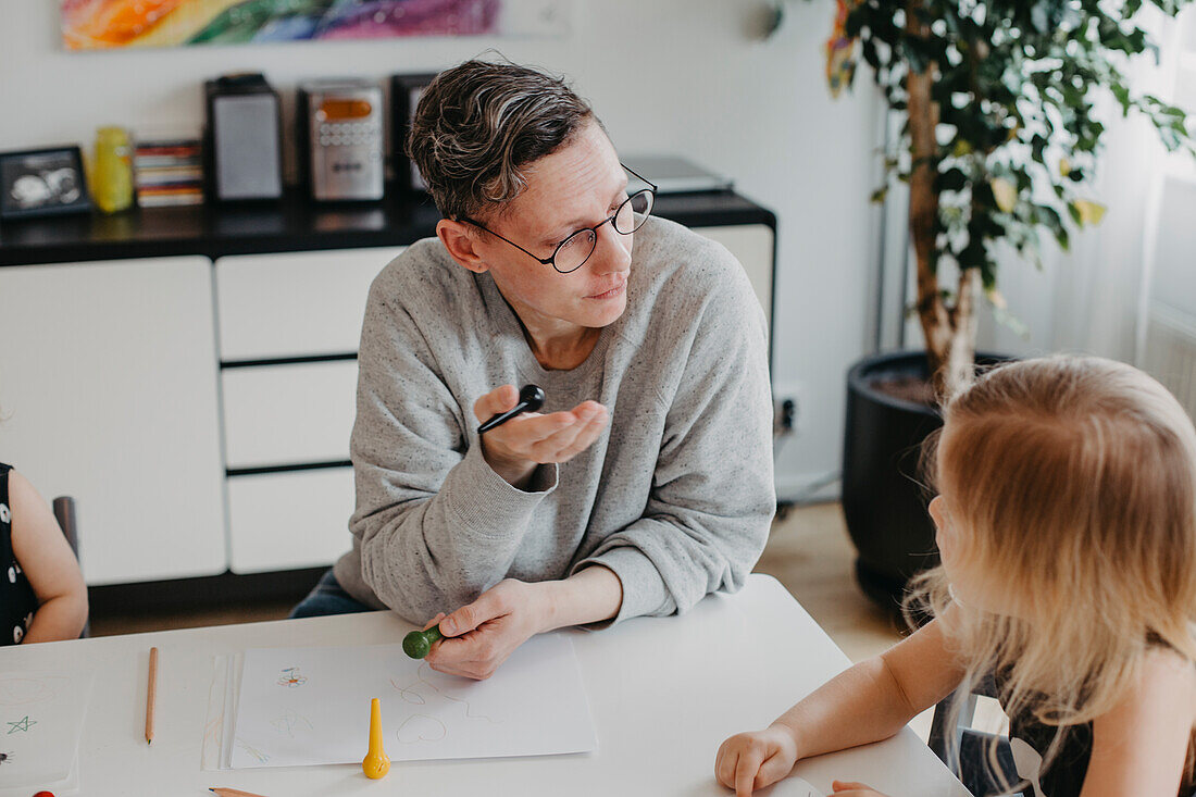 Mother talking to daughter