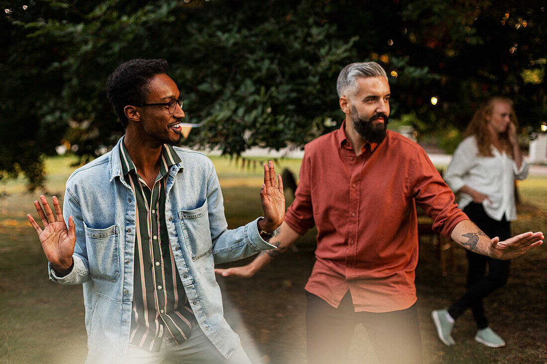 Male friends having fun in park