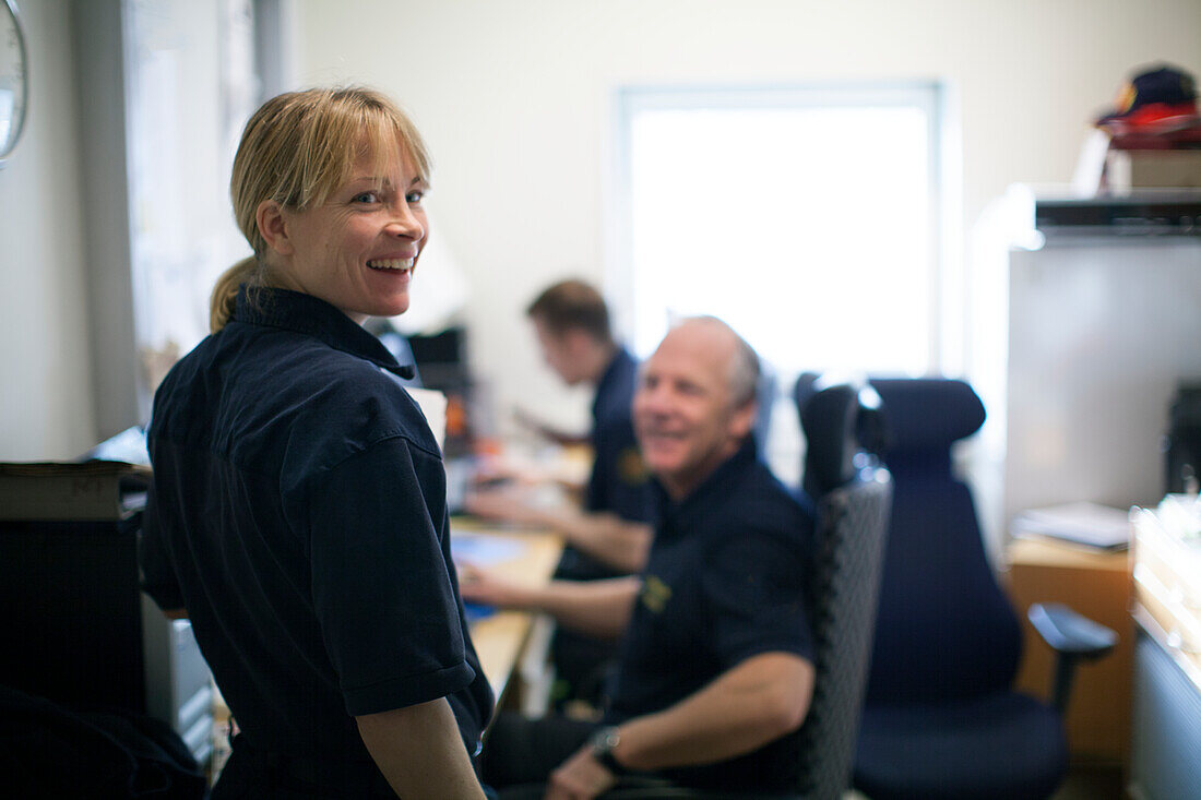 Female firefighter in office