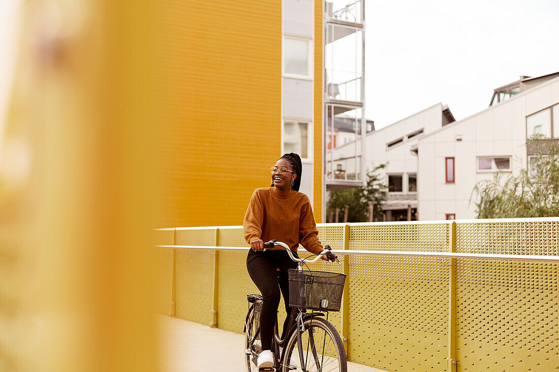 View of young woman cycling