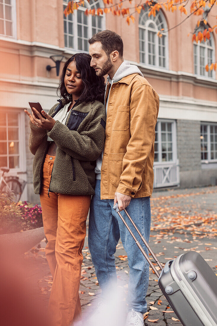 Couple looking at cell phone