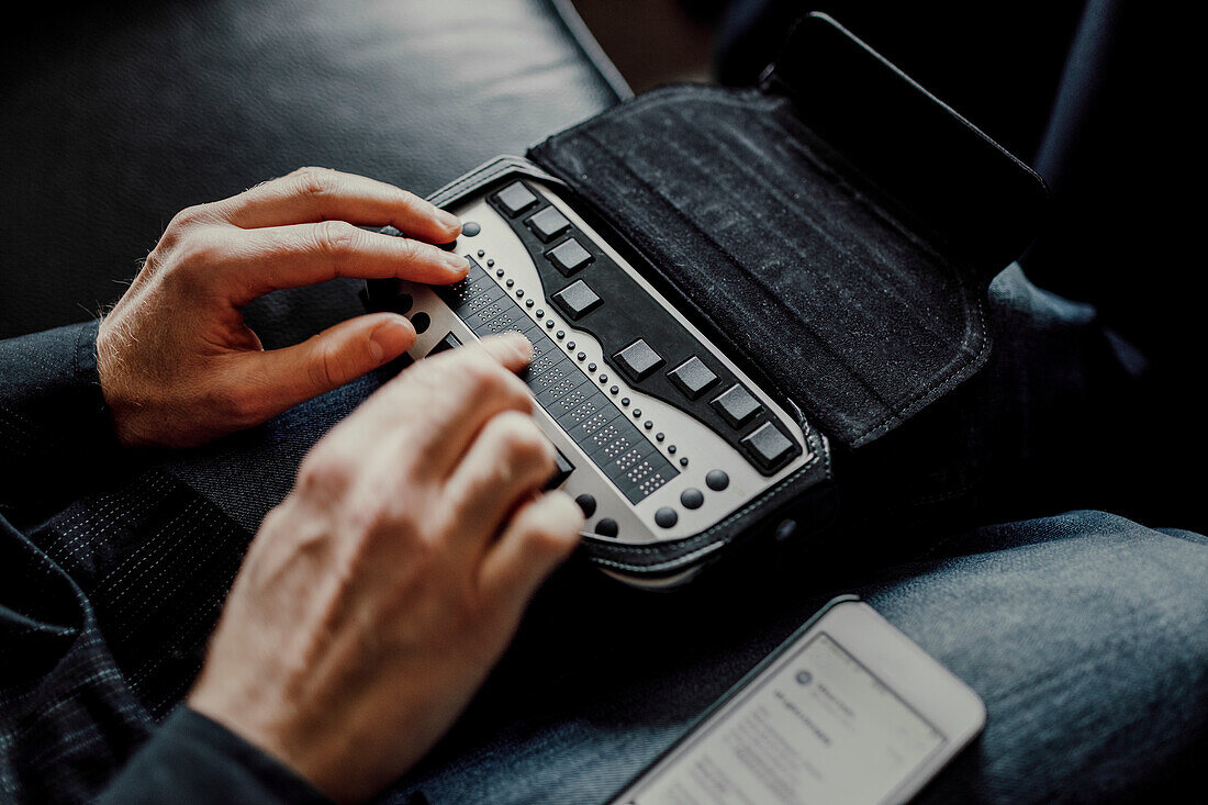 Man using Braille keyboard