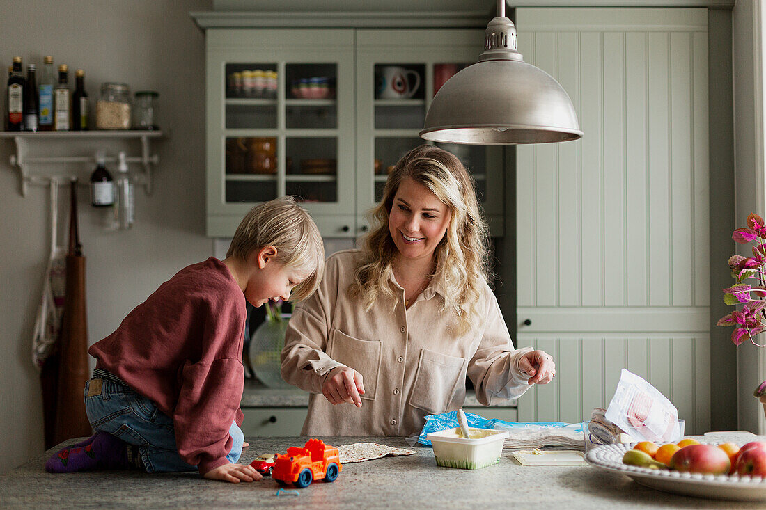 Mother with son in kitchen