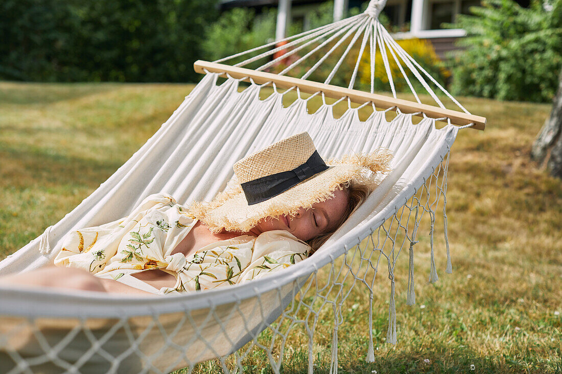 Woman relaxing on hammock