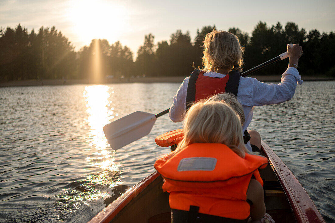 Mother with children kayaking