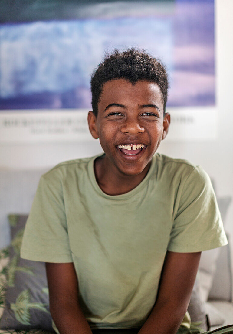 Happy teenage boy looking at camera