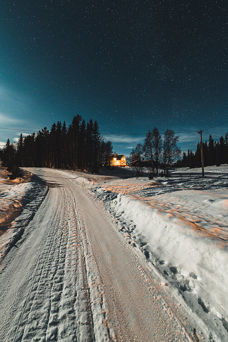 Snowy road at night