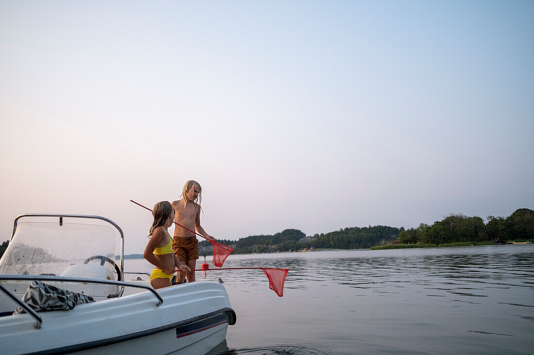 Children standing on boat