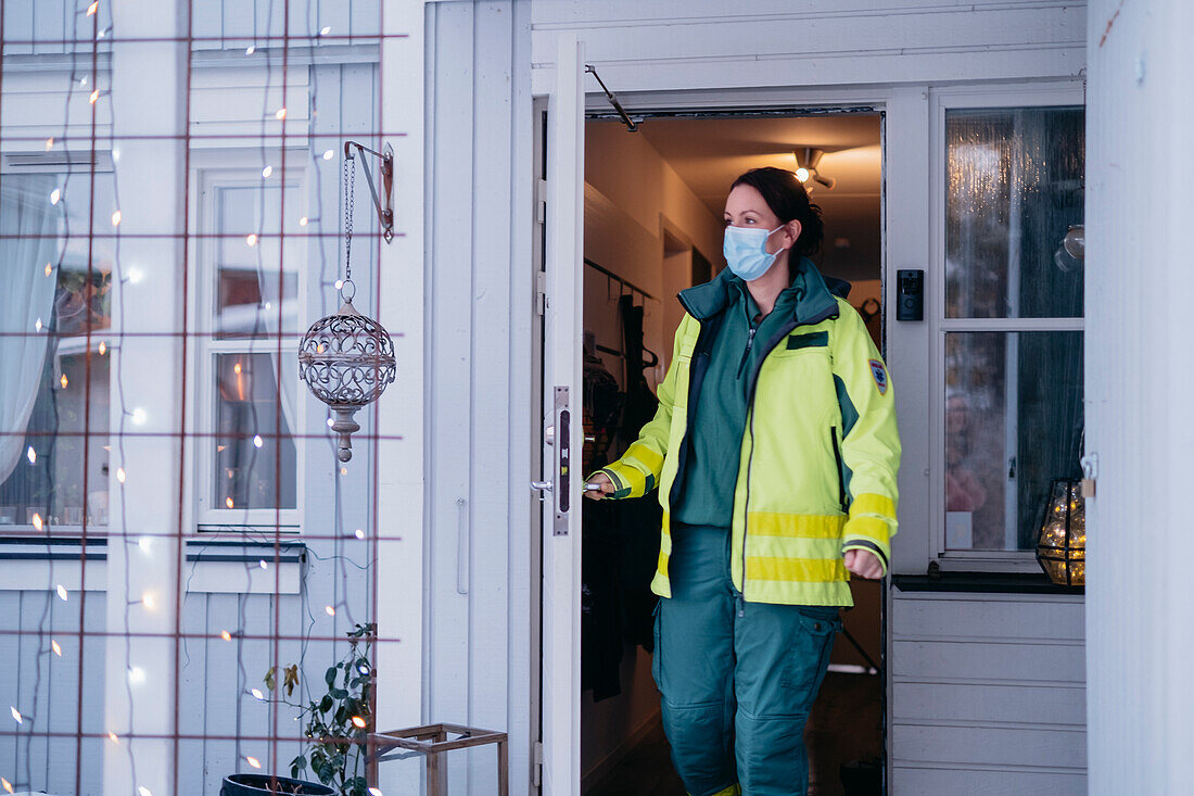 Ambulance staff leaving patient's home